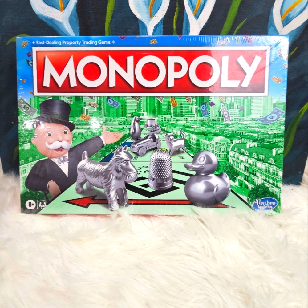 Hasbo Classic Monopoly Game Edition  with the Thimble. Yes the thimble is back!